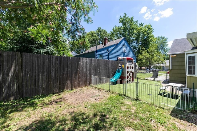 1306 W 29th St S, Independence, MO 64052 - fenced backyard with a playground