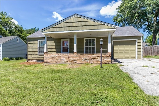 1306 W 29th St S, Independence, MO 64052 - view of front facade with an attached garage, driveway, and a shingled roof