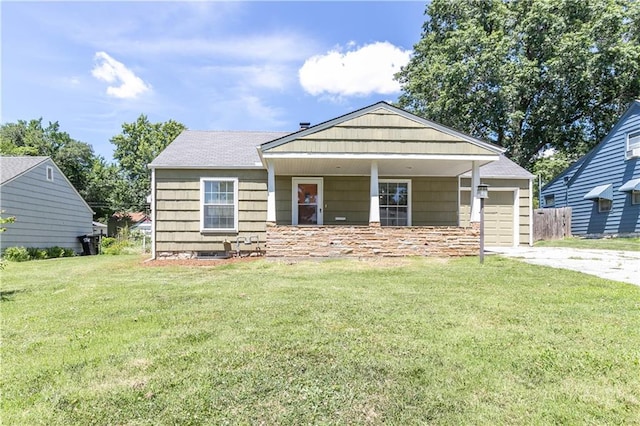 1306 W 29th St S, Independence, MO 64052 - view of front of property featuring driveway, an attached garage, and a front lawn