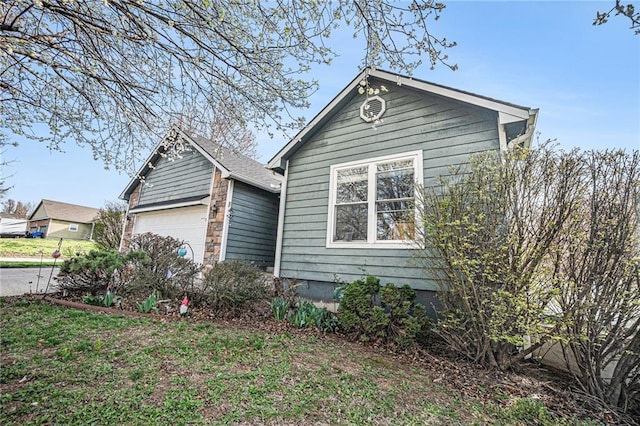 201 S Melrose Ln, Tonganoxie, KS 66086 - view of home's exterior featuring an attached garage
