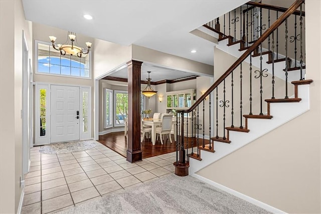 entryway featuring recessed lighting, stairway, tile patterned flooring, baseboards, and a chandelier
