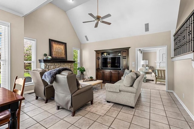 living area featuring baseboards, high vaulted ceiling, a ceiling fan, a fireplace, and light tile patterned floors