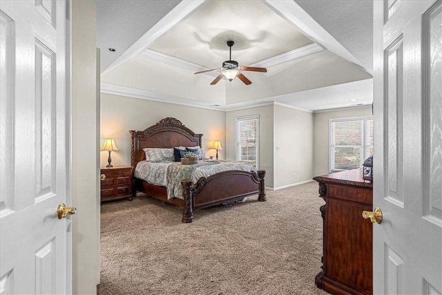 bedroom featuring baseboards, carpet, a ceiling fan, crown molding, and a raised ceiling