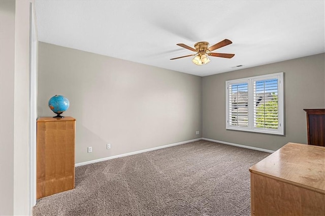 unfurnished bedroom featuring carpet floors, visible vents, and baseboards