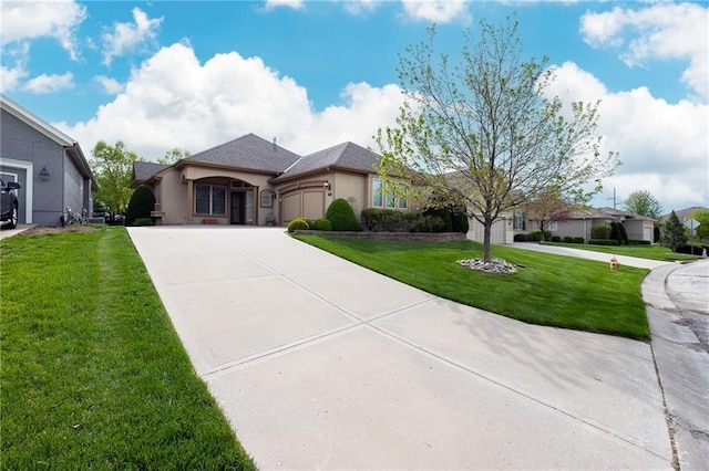 view of front of house featuring an attached garage, driveway, a front lawn, and stucco siding