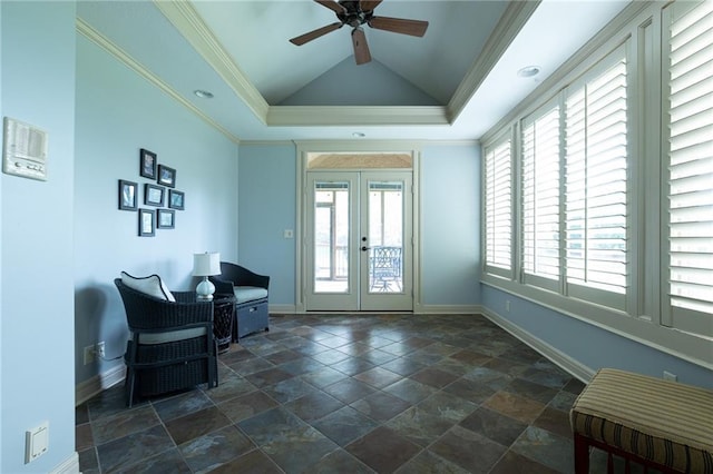 interior space with french doors, baseboards, a ceiling fan, and crown molding