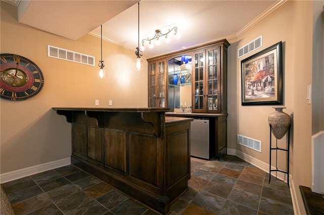 bar featuring stone tile floors, baseboards, indoor wet bar, and visible vents