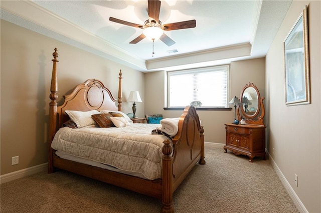 bedroom featuring a raised ceiling, visible vents, a ceiling fan, light carpet, and baseboards