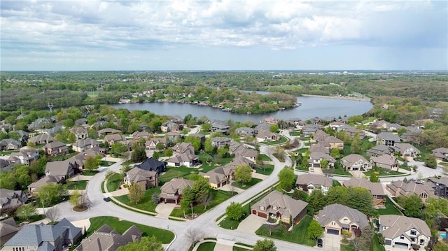 birds eye view of property with a residential view and a water view