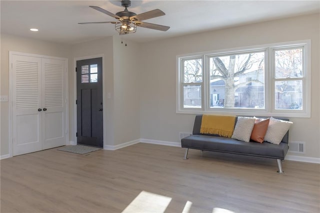 909 Bell Dr, Excelsior Springs, MO 64024 - entryway with plenty of natural light, baseboards, wood finished floors, a ceiling fan, and recessed lighting