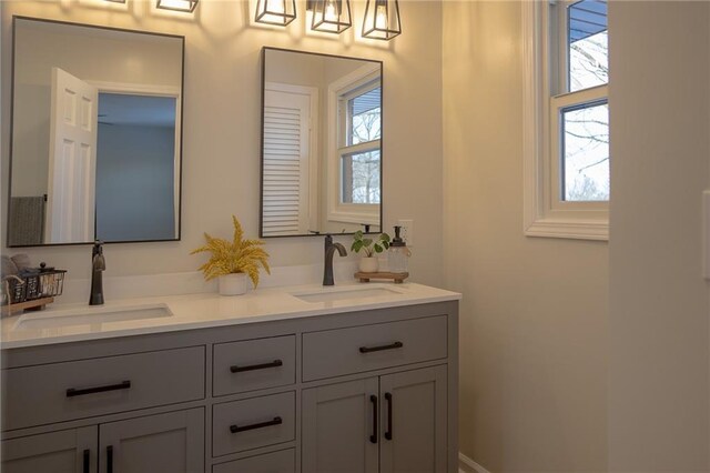 909 Bell Dr, Excelsior Springs, MO 64024 - full bathroom featuring plenty of natural light and double vanity