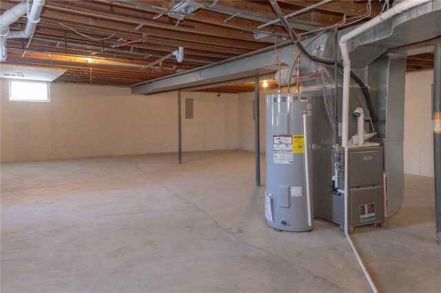 909 Bell Dr, Excelsior Springs, MO 64024 - basement with water heater and heating unit