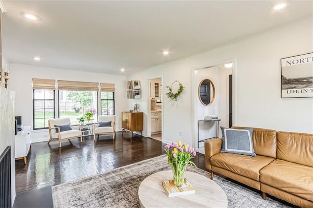 living room with crown molding, recessed lighting, and wood finished floors