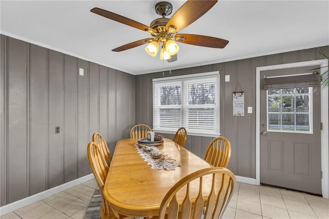 dining room featuring light tile patterned floors, ceiling fan, and a healthy amount of sunlight