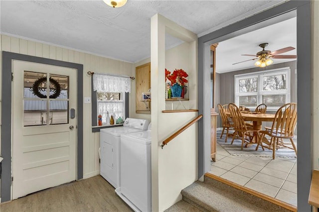laundry room with independent washer and dryer, crown molding, ceiling fan, laundry area, and baseboards