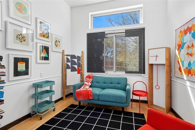 1610 Summit St, Kansas City, MO 64108 - sitting room featuring baseboards and wood finished floors