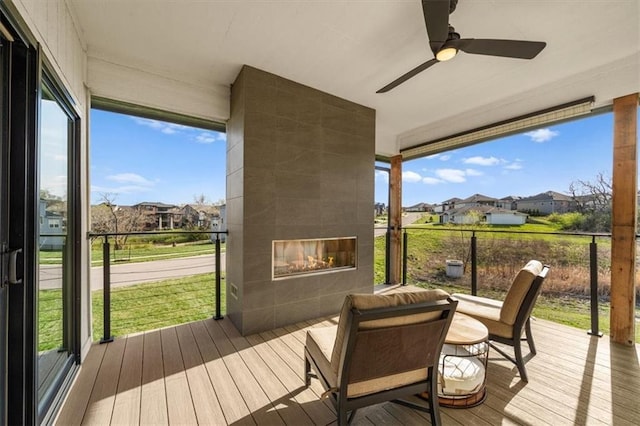 22530 W 87th Ter, Lenexa, KS 66227 - deck featuring a tiled fireplace, a residential view, and a ceiling fan