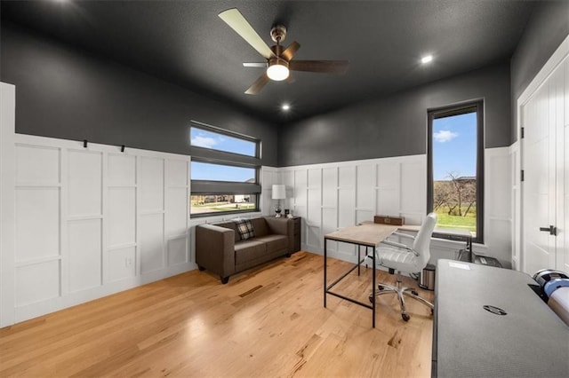 22530 W 87th Ter, Lenexa, KS 66227 - home office with light wood finished floors, ceiling fan, a wainscoted wall, recessed lighting, and a decorative wall