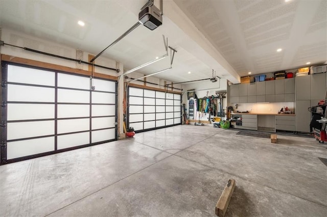 22530 W 87th Ter, Lenexa, KS 66227 - garage featuring a garage door opener and recessed lighting