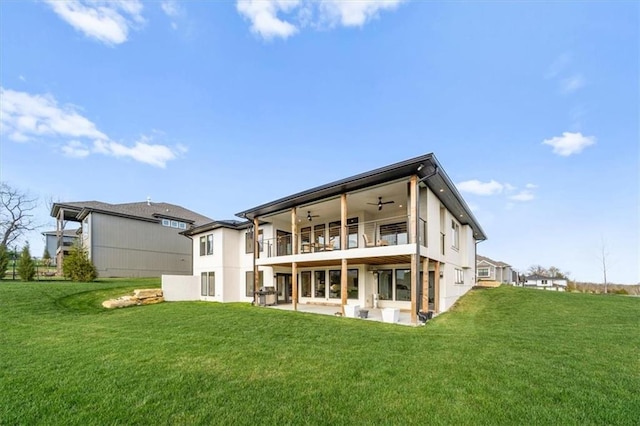 22530 W 87th Ter, Lenexa, KS 66227 - back of property with a ceiling fan, a yard, a patio, and a balcony