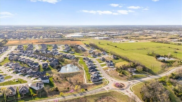 22530 W 87th Ter, Lenexa, KS 66227 - aerial view of property and surrounding area featuring nearby suburban area and a large body of water