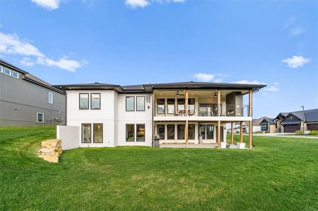 22530 W 87th Ter, Lenexa, KS 66227 - rear view of house featuring a balcony, a lawn, and a ceiling fan