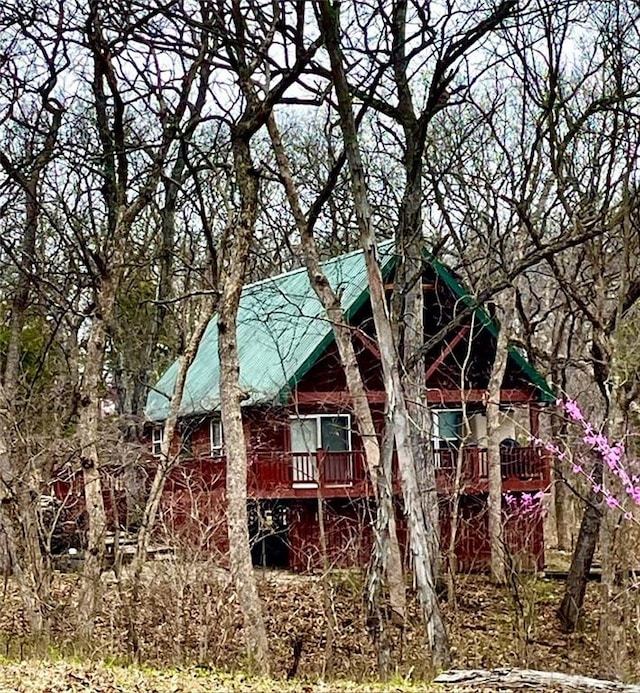 518 SW Lakeside Dr, La Cygne, KS 66040 - view of property exterior with a deck