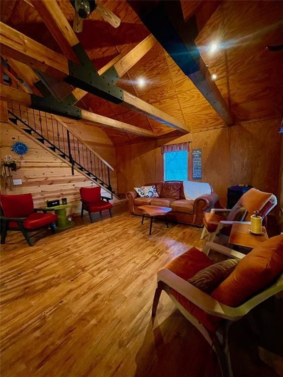 518 SW Lakeside Dr, La Cygne, KS 66040 - sitting room with wood walls, stairs, and wood finished floors