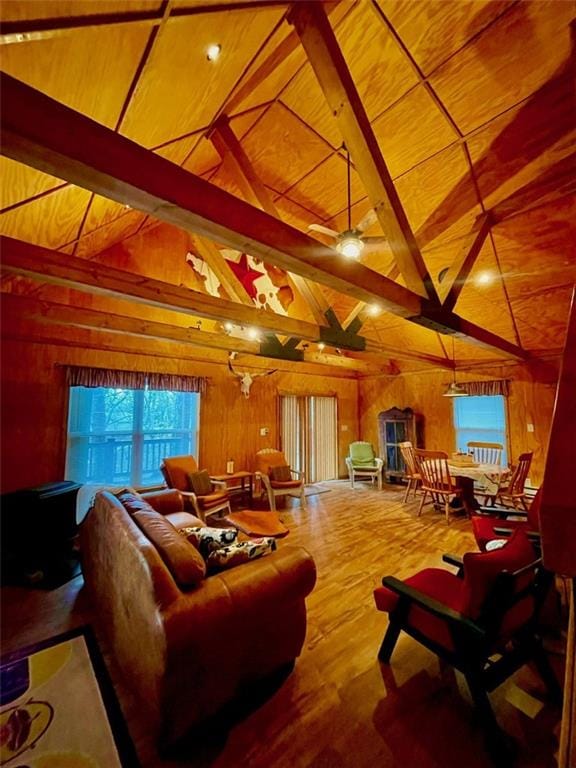 518 SW Lakeside Dr, La Cygne, KS 66040 - living area with wood walls, wood finished floors, wooden ceiling, and a ceiling fan