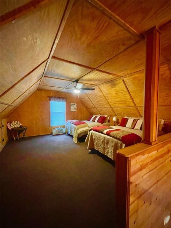 518 SW Lakeside Dr, La Cygne, KS 66040 - bedroom featuring vaulted ceiling, carpet floors, and wood walls