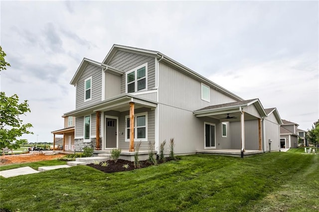 16827 W 164th Ter, Olathe, KS 66062 - view of front of home with a ceiling fan, a porch, and a front yard