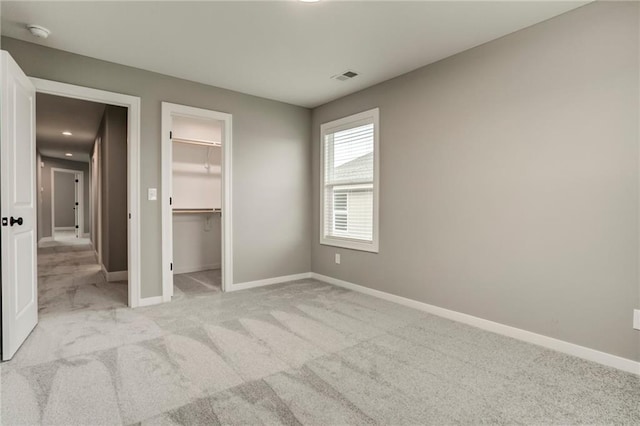 16827 W 164th Ter, Olathe, KS 66062 - unfurnished bedroom with light carpet and a walk in closet