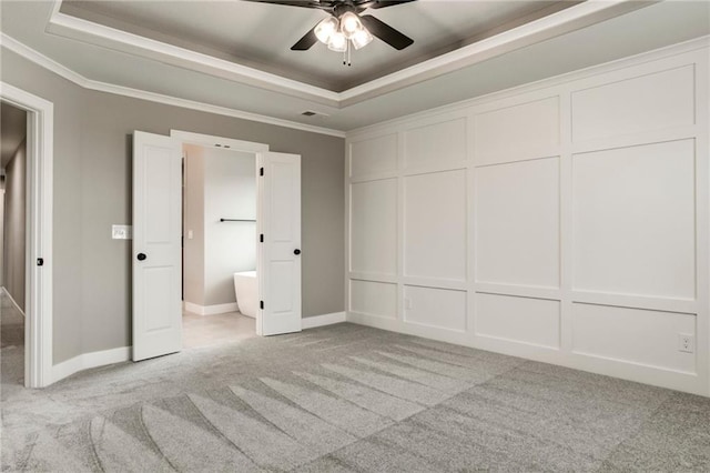 16827 W 164th Ter, Olathe, KS 66062 - unfurnished bedroom with a raised ceiling, light colored carpet, crown molding, a decorative wall, and ceiling fan