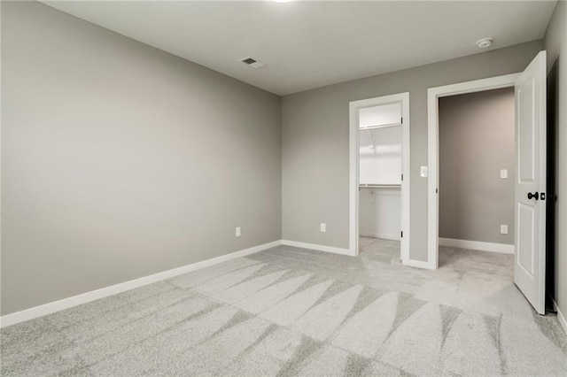 16827 W 164th Ter, Olathe, KS 66062 - unfurnished bedroom with light colored carpet and a spacious closet