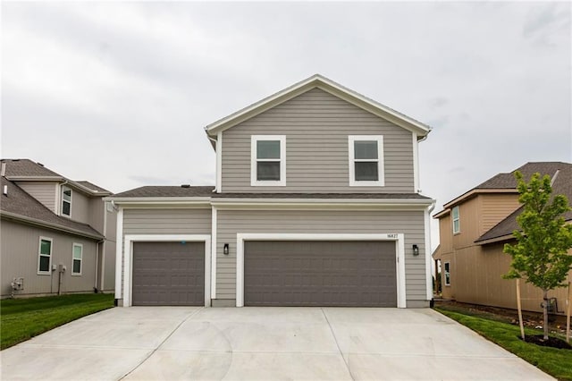 16827 W 164th Ter, Olathe, KS 66062 - view of front of house featuring driveway and an attached garage