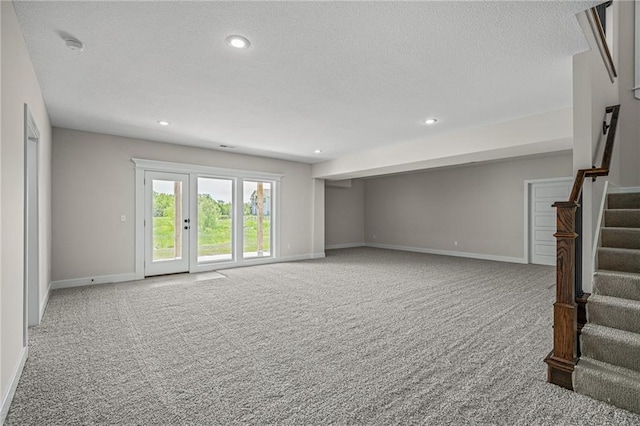 19389 W 114th Ter, Olathe, KS 66061 - basement with carpet, stairs, baseboards, a textured ceiling, and recessed lighting