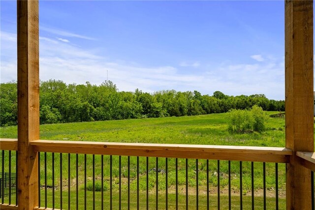 19389 W 114th Ter, Olathe, KS 66061 - deck featuring a lawn and a view of rural / pastoral area