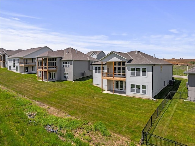 19389 W 114th Ter, Olathe, KS 66061 - back of house with a balcony, a residential view, and a patio