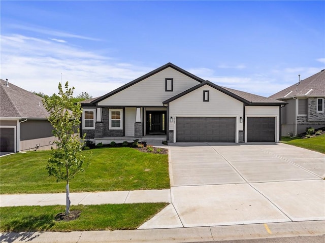 19389 W 114th Ter, Olathe, KS 66061 - view of front facade featuring a garage, concrete driveway, and a front lawn