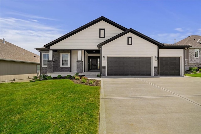 19389 W 114th Ter, Olathe, KS 66061 - view of front of property with a garage, a front lawn, and driveway