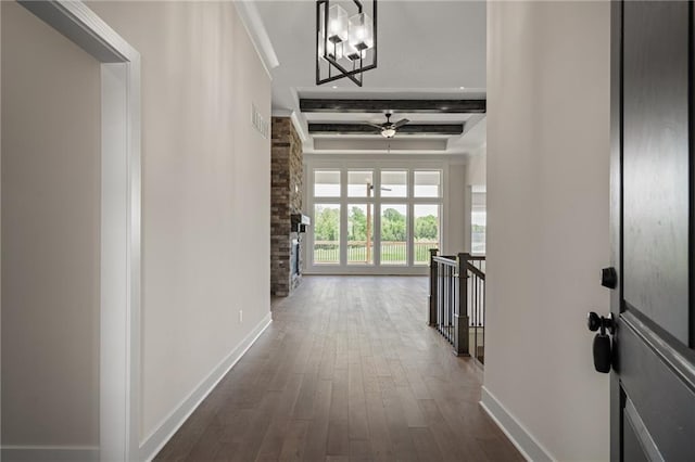 19389 W 114th Ter, Olathe, KS 66061 - corridor with an upstairs landing, baseboards, dark wood-style flooring, beamed ceiling, and a chandelier