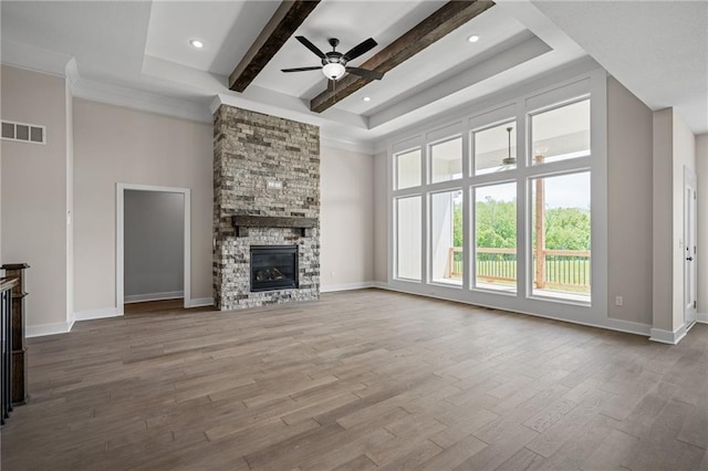 19389 W 114th Ter, Olathe, KS 66061 - unfurnished living room featuring a ceiling fan, beamed ceiling, wood finished floors, baseboards, and recessed lighting