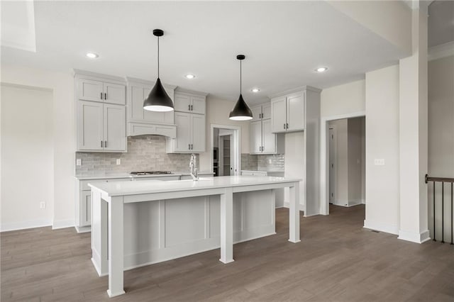 19389 W 114th Ter, Olathe, KS 66061 - kitchen featuring stainless steel gas cooktop, light countertops, backsplash, baseboards, and recessed lighting