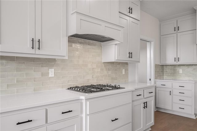 19389 W 114th Ter, Olathe, KS 66061 - kitchen with stainless steel gas stovetop, tasteful backsplash, light countertops, and white cabinetry