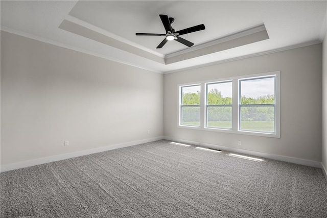 19389 W 114th Ter, Olathe, KS 66061 - carpeted empty room featuring a raised ceiling, ornamental molding, baseboards, and a ceiling fan