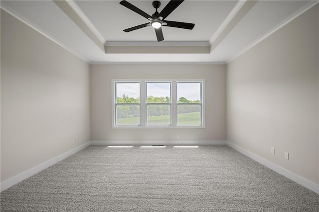19389 W 114th Ter, Olathe, KS 66061 - carpeted spare room with a raised ceiling, ornamental molding, ceiling fan, and baseboards