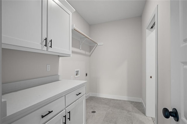 19389 W 114th Ter, Olathe, KS 66061 - clothes washing area with washer hookup, electric dryer hookup, cabinet space, and baseboards