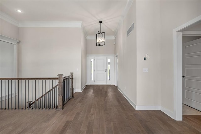 19389 W 114th Ter, Olathe, KS 66061 - entrance foyer featuring a chandelier, wood finished floors, crown molding, baseboards, and recessed lighting