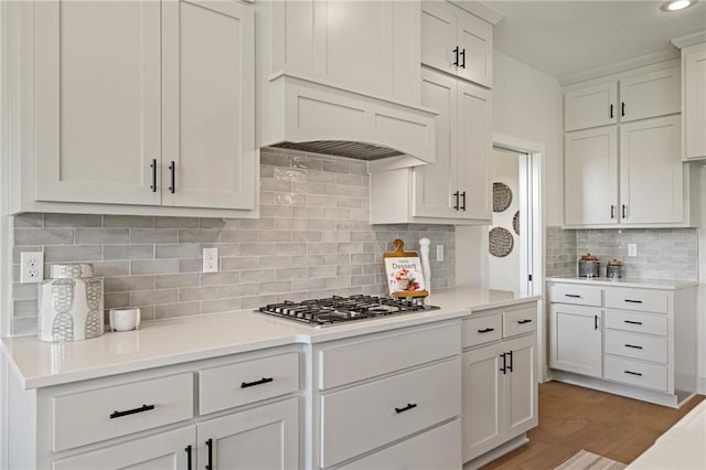 19389 W 114th Ter, Olathe, KS 66061 - kitchen with stainless steel gas cooktop, light countertops, white cabinetry, and decorative backsplash