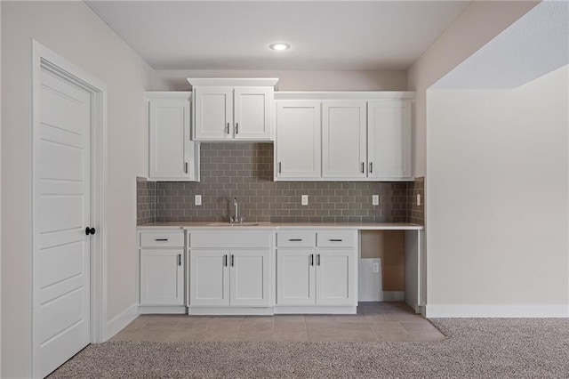 19389 W 114th Ter, Olathe, KS 66061 - kitchen featuring light countertops, white cabinetry, decorative backsplash, light colored carpet, and recessed lighting